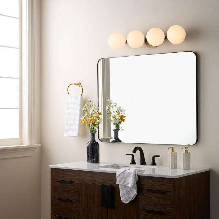 Jasper - 4 Light Modern and Contemporary Aged Brass Globe Vanity