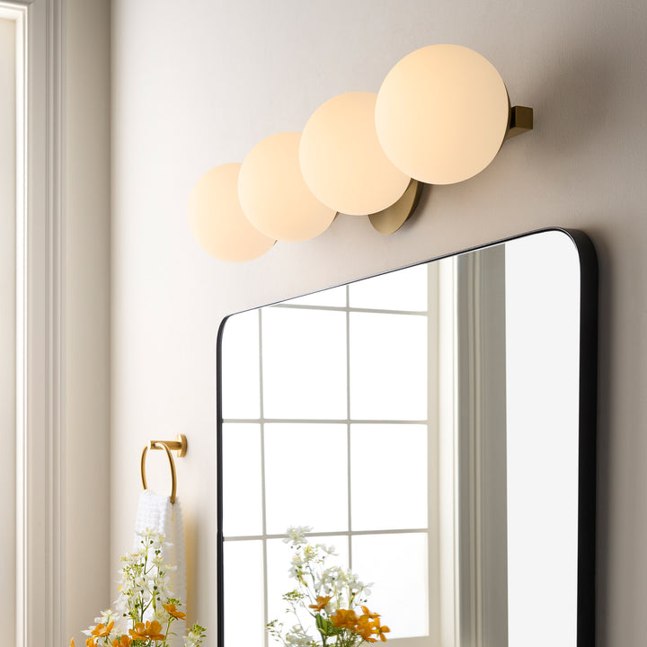 Jasper - 4 Light Modern and Contemporary Aged Brass Globe Vanity