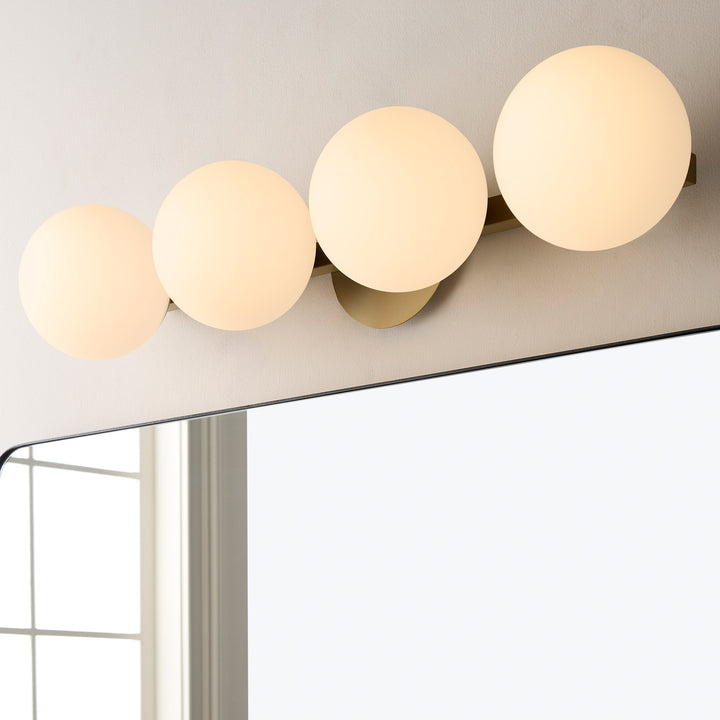 Jasper - 4 Light Modern and Contemporary Aged Brass Globe Vanity